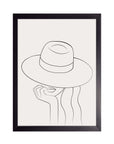 Fedora: figura con sombrero de ala ancha y la mano en la barbilla en línea negra fina, cuadro con marco negro (SL-016)